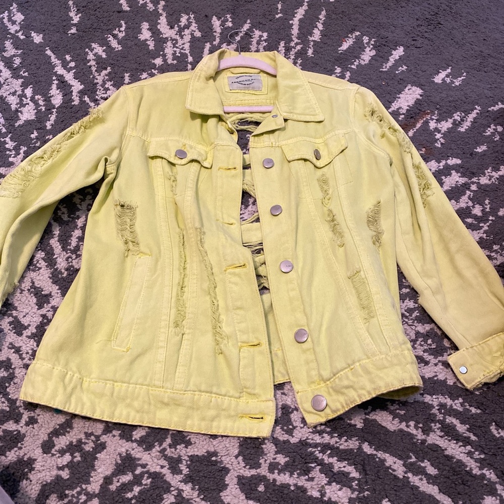 Women’s distressed jean jacket from AKIRA